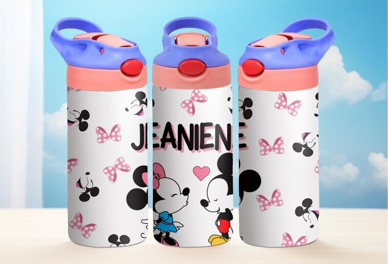 May include: Three white water bottles with pink and blue lids and handles. The bottles feature a Mickey Mouse and Minnie Mouse design with pink bows and the name "JEANINE" printed on the middle bottle.