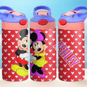 May include: Three red and white water bottles with a Mickey Mouse and Minnie Mouse design. The bottles have a blue lid and a pink base. One bottle has the name "Ashley" written on it in purple letters.