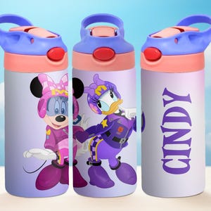 May include: Three purple and pink water bottles with different character designs. The first bottle features Minnie Mouse in a purple racing suit. The second bottle features Daisy Duck in a purple racing suit. The third bottle has the name "Cindy" written in purple letters.