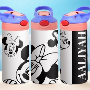 May include: Three white water bottles with black and white images of Minnie Mouse. The bottle on the right has the name "Aaliyah" written in black on a black background.