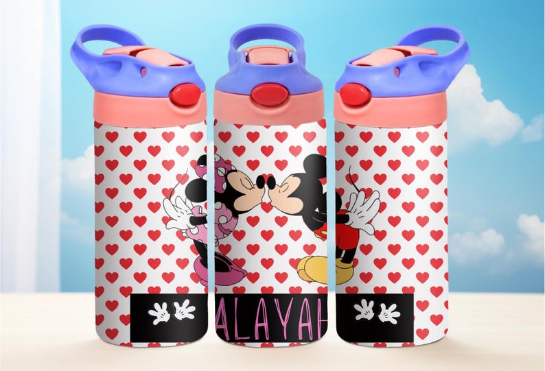 May include: Three pink and blue water bottles with a white background featuring a red heart pattern. The bottles have a Mickey Mouse and Minnie Mouse kissing graphic and the name "ALAYAH" printed on the middle bottle.