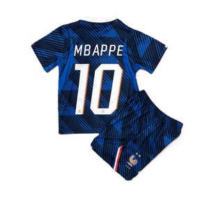 May include: A blue football shirt and matching shorts set featuring a dark blue diagonal striped pattern. The shirt displays the name MBAPPE and the number 10 in white. The shorts feature a small cockerel emblem with two stars above it.