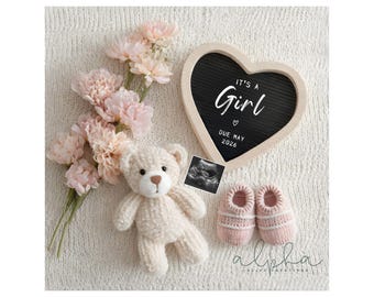 May include: A heart-shaped sign with the text "IT'S A Girl" and "DUE MAY 2026" sits next to a knitted teddy bear, a sonogram, pink baby booties, and pink flowers. The image is on a white textured surface.