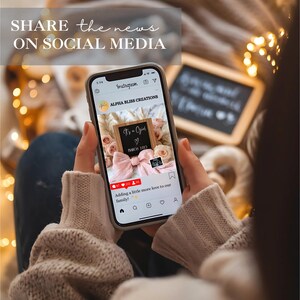 May include: A smartphone displaying a social media post announcing a new baby girl. The post features a pink and white bow, a sign that says "It's a Girl", and the text "Adding a little more love to our family".