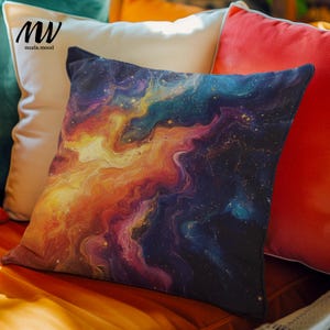 May include: Square throw pillow with a vibrant abstract design in shades of orange, yellow, blue, and purple, resembling a nebula or galaxy. The pillow is placed among other pillows of various colors.