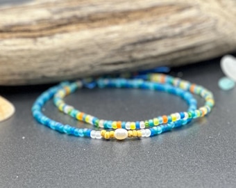 At the Beach stretch seed bracelets.  Choose your size. 3mm beads