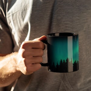 Nature Lover Gift Aurora Borealis Mug Northern Lights Design Coffee Cup Mountain Scene Starry Sky Artwork Pine Tree Silhouette Wilderness Enthusiast Present Camping Trip Essential Morning Coffee Companion Ceramic Construction Microwave Safe