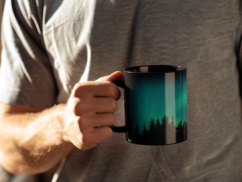 Nature Lover Gift Aurora Borealis Mug Northern Lights Design Coffee Cup Mountain Scene Starry Sky Artwork Pine Tree Silhouette Wilderness Enthusiast Present Camping Trip Essential Morning Coffee Companion Ceramic Construction Microwave Safe