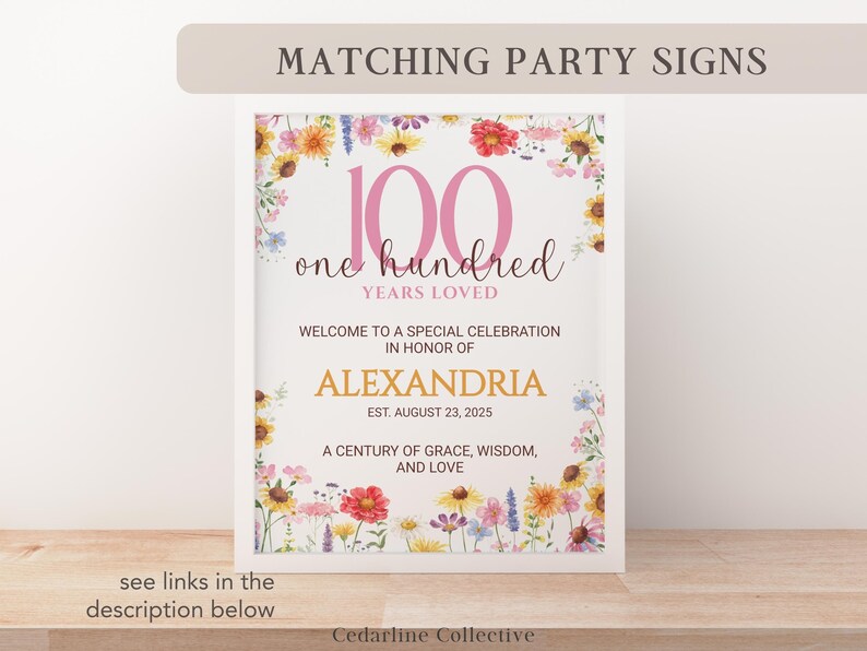 May include: A framed party sign with floral accents. The sign reads "100 Years Loved" with the name "Alexandria" and the date "August 23, 2025". The sign is decorated with a floral border and the text "Matching Party Signs".