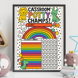 May include: A framed classroom potty training chart with colorful illustrations of a lion, bunny, dinosaur, and rainbow. The chart includes space for a student's name and star stickers for tracking progress.