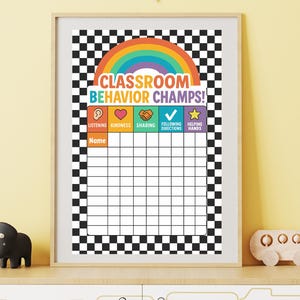 May include: A framed classroom behaviour chart featuring a rainbow and the words "Classroom Behavior Champs!". The chart has a black and white chequered border and sections for listening, kindness, sharing, following directions, and helping hands.