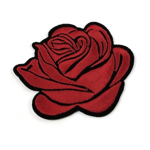 May include: Embroidered red rose patch with a black border. The patch shows detailed stitching, highlighting the petals and form of the flower. Suitable for adding decoration to clothes or accessories.