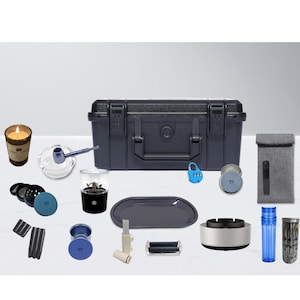 May include: A white ceramic mug with a black handle and the text "But First, Coffee" in a black, handwritten-style font. The mug is on a white surface.