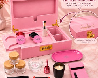 May include: A pink wooden storage box with a gold combination lock, featuring an open lid and internal compartments. Included are three glass jars with bamboo lids, a glass dish, a pink tray, a black candle, a pink pouch, and various tools.