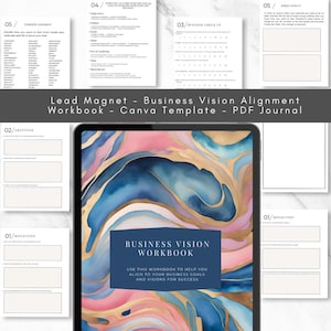 May include: A digital tablet displaying a business vision workbook with a blue, pink, and gold marbled background. The workbook title is "Business Vision Workbook" and the text below reads "Use this workbook to help you align to your business goals and visions for success."