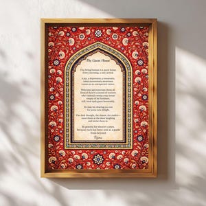 May include: Framed print featuring a poem titled "The Guest House" by Rumi. The artwork has a gold frame and a red and gold floral border. The poem is displayed in a decorative arch shape with black text on a cream background.