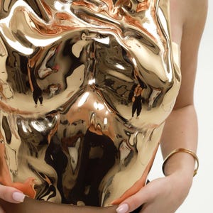 one shoulder corset,
gold acrylic corset,
wet look bustier,
metallic bustier,
luxury acrylic wear,
party outfit gift,
lacquer acrylic top,
high fashion corset,
luxury gift top,
stage wear bustier,
molten acrylic top,
DJ performance top,
dramatic outfit piece,