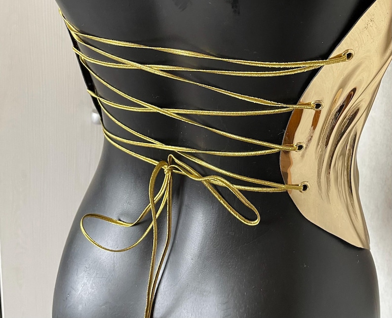one shoulder corset,
gold acrylic corset,
wet look bustier,
metallic bustier,
luxury acrylic wear,
party outfit gift,
lacquer acrylic top,
high fashion corset,
luxury gift top,
stage wear bustier,
molten acrylic top,
DJ performance top,
dramatic outfit piece,