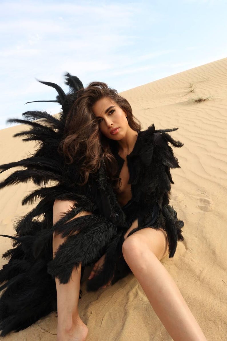 old Hollywood glam gown with feathers for festive photoshoot