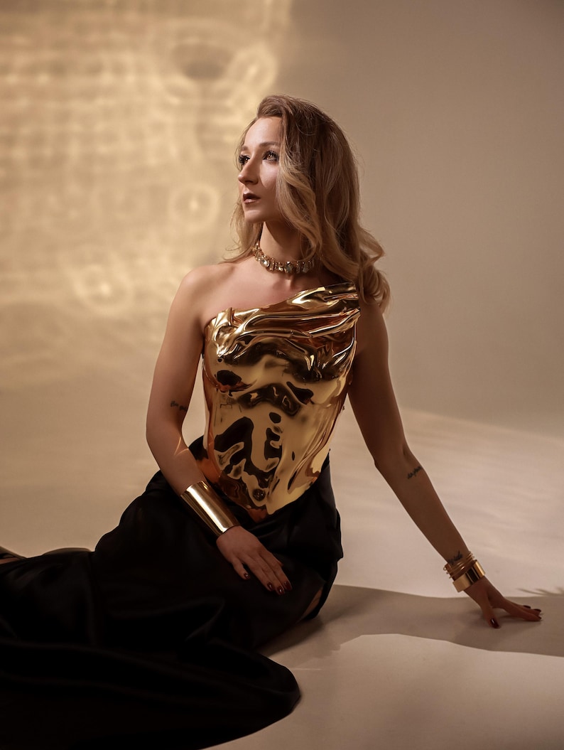 one shoulder corset,
gold acrylic corset,
wet look bustier,
metallic bustier,
luxury acrylic wear,
party outfit gift,
lacquer acrylic top,
high fashion corset,
luxury gift top,
stage wear bustier,
molten acrylic top,
DJ performance top,
dramatic outfit piece,