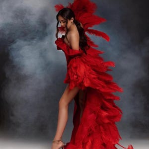 woman wearing red feather robe for photoshoot