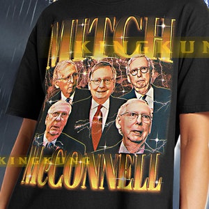 May include: Black unisex t-shirt with a graphic print of a group of men with the text "Mitch McConnell" in yellow letters.