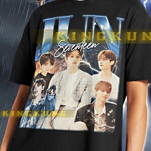 May include: Black unisex t-shirt with a graphic print of a K-pop group called "JUN Seventeen". The graphic is a collage of the band members in different poses. The shirt is being modeled by a person wearing black pants.