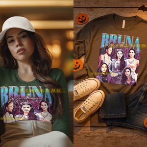 May include: A green long-sleeve shirt with the text "BRUNA Magazine" and a graphic of five women. The shirt is paired with jeans and sneakers. The image also includes a woman wearing a white cap and the same shirt.