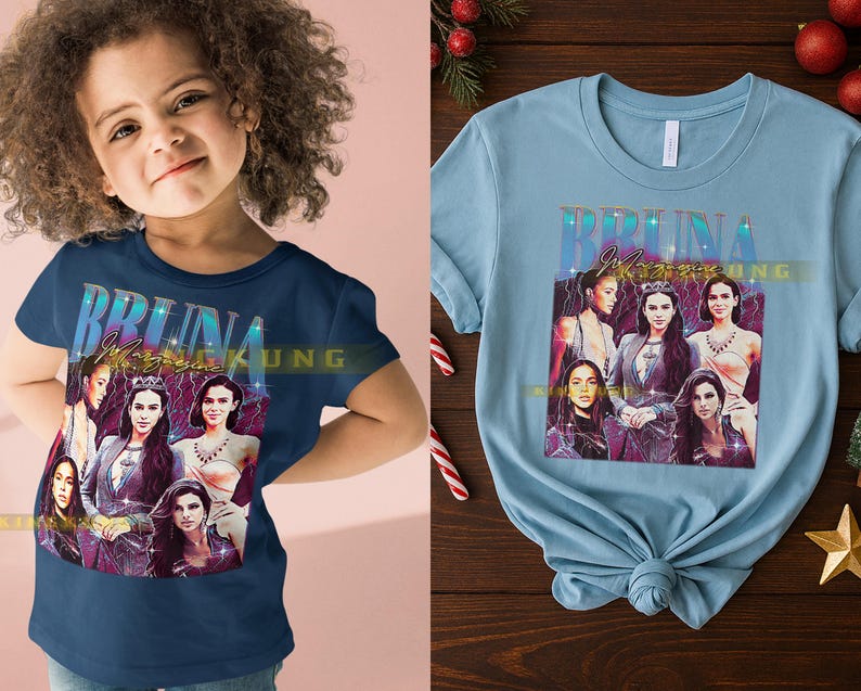 May include: A navy blue t-shirt featuring a graphic of six women with the text "BRUNA Magazine". The image has a vintage aesthetic with a purple and gold color scheme. The shirt is displayed on a child.
