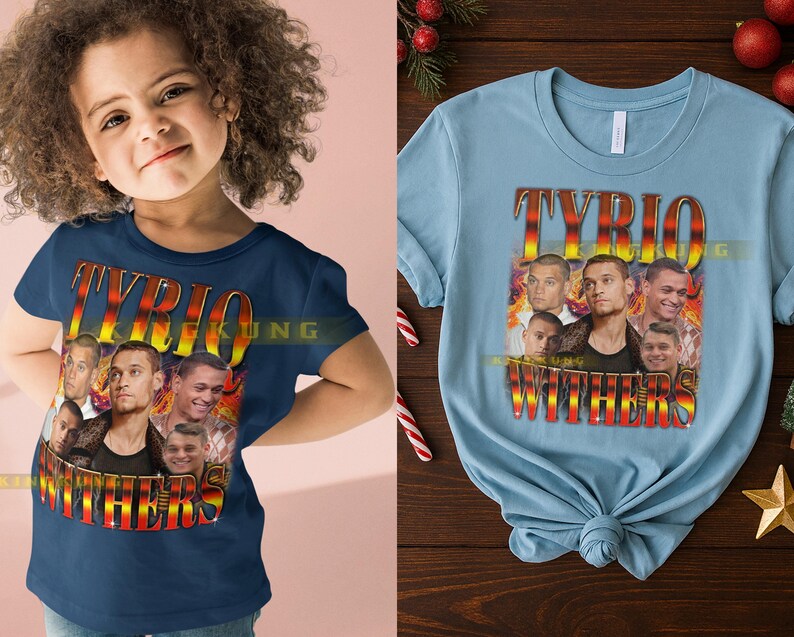 May include: A navy blue t-shirt and a light blue t-shirt featuring a graphic design. The design includes the name "TYRIO WITHERS" in a stylized font, along with multiple images of a person. The shirts are short-sleeved.