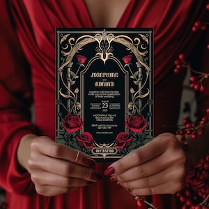 May include: Black wedding invitation with gold accents and red roses. The invitation reads "Josephine and Adrian" and includes the date, time, and location of the wedding. RSVP information is also included.