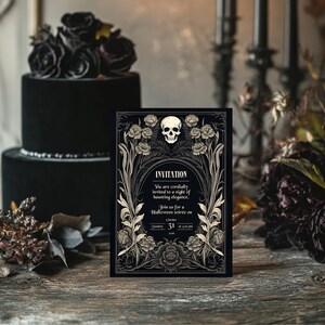 May include: A black and gold Halloween invitation with a skull and floral design. The invitation reads "You are cordially invited to a night of haunting elegance. Join us for a Halloween soir&eacute;e on Sunday, October 31st at 5:00 pm."