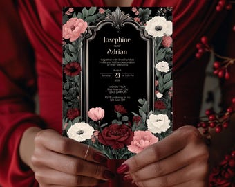 May include: Black wedding invitation with a silver frame and floral design. The invitation reads "Josephine and Adrian together with their families invite you to the celebration of their wedding Sunday August 23 5:00 PM 202X MOON VILLA Rise Avenue 234 12345 DARTON RSVP until May 1st to 123-456-789"