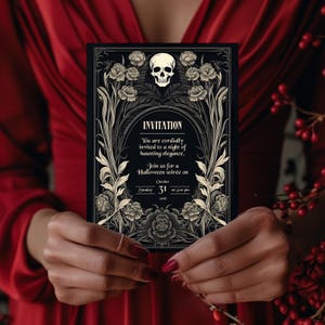 May include: Black and gold Halloween invitation with a skull and floral design. The invitation reads "You are cordially invited to a night of haunting elegance. Join us for a Halloween soir&eacute;e on October 31 at 5:00 pm."