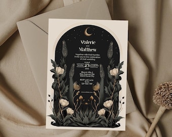 May include: Wedding invitation featuring the names "Valerie and Matthew" in elegant script. The design includes floral illustrations, a crescent moon, and the wedding details: date, time, and location. The invitation is set against a dark background with a beige envelope.
