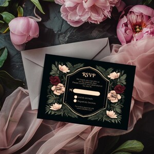 May include: Black RSVP card with a floral design featuring red, white, and green flowers. The text reads "RSVP" and includes a space to write a name and check boxes for "joyfully accepts" or "regretfully declines".