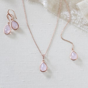 Rose gold necklace and earrings set with ice pink gemstone