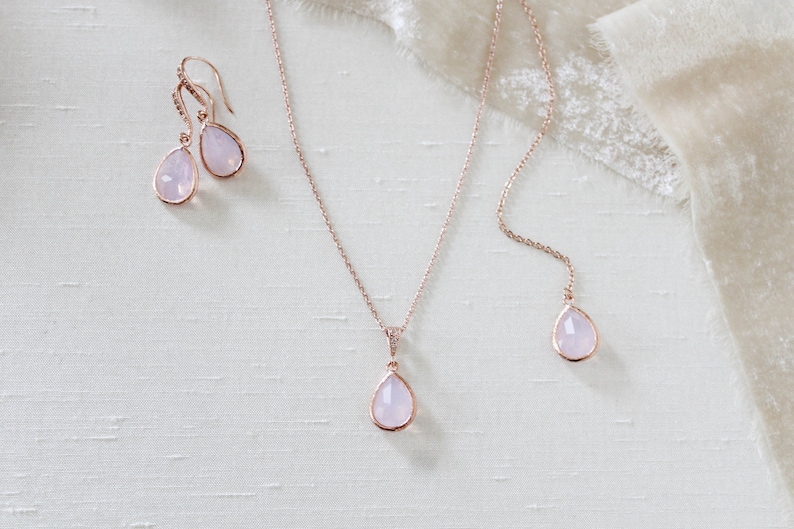 Rose gold necklace and earrings set with ice pink gemstone