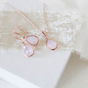 Rose gold necklace and earrings set with ice pink gemstone