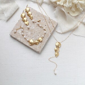 gold filled back necklace with cascading leaf pendant and freshwater pearls