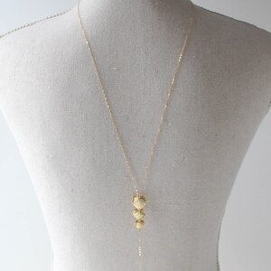 gold filled backdrop necklace with cascading leaf pendant and freshwater pearls