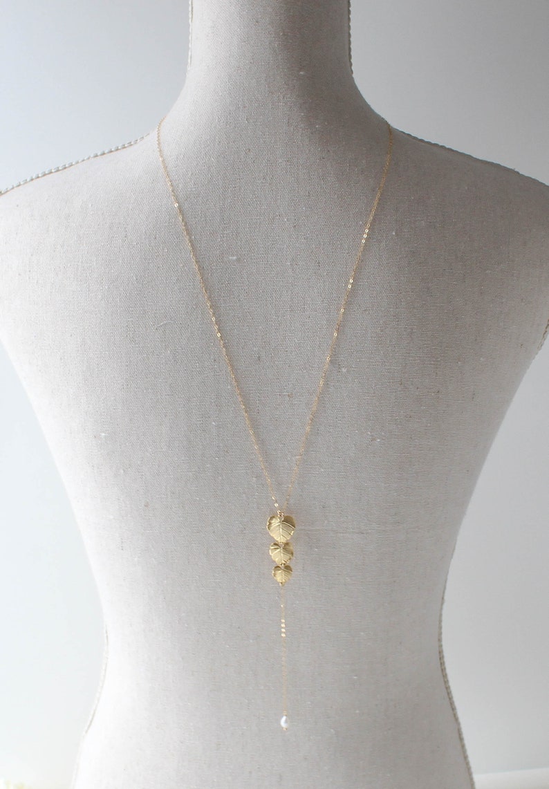 gold filled backdrop necklace with cascading leaf pendant and freshwater pearls