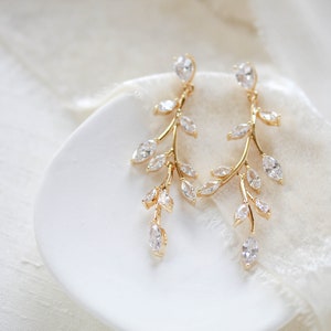 Long gold cubic zirconia vine earrings
