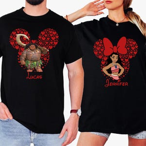 a man and a woman wearing mickey mouse shirts