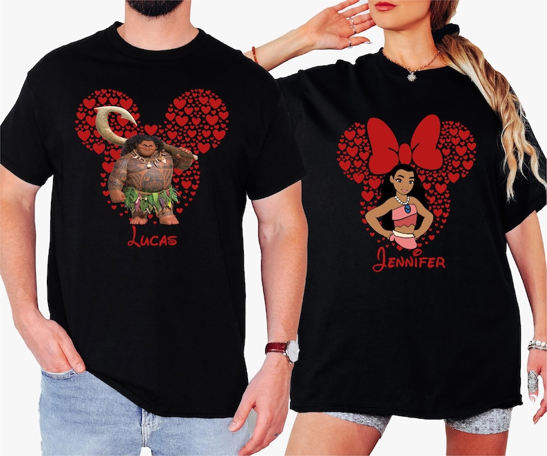 a man and a woman wearing mickey mouse shirts