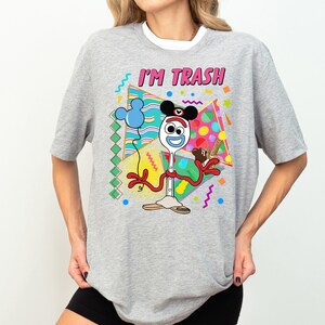 a woman wearing a mickey mouse t - shirt