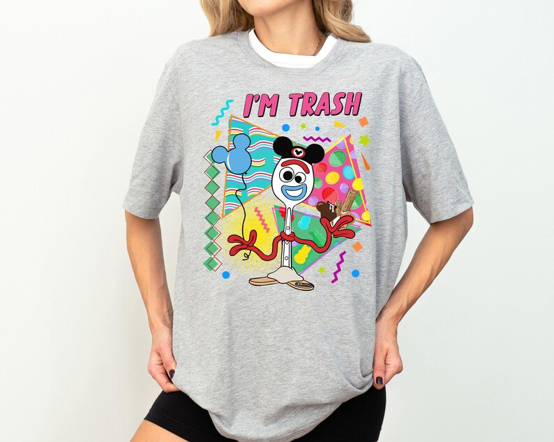 a woman wearing a mickey mouse t - shirt