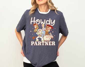 Camiseta Toy Story Howdy Partner, Camiseta Xerife Woody e Jessie Buzz Lightyear da Disney no Oeste, Camiseta Férias em Família na Disneylândia 2026 no Oeste