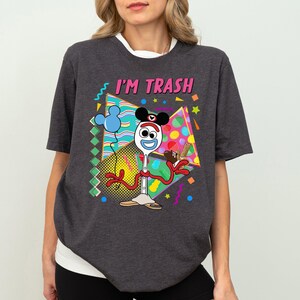 a woman wearing a t - shirt that says i'm trash