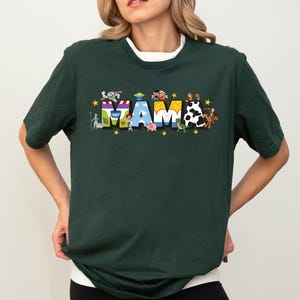a woman wearing a tshirt with the word mam printed on it